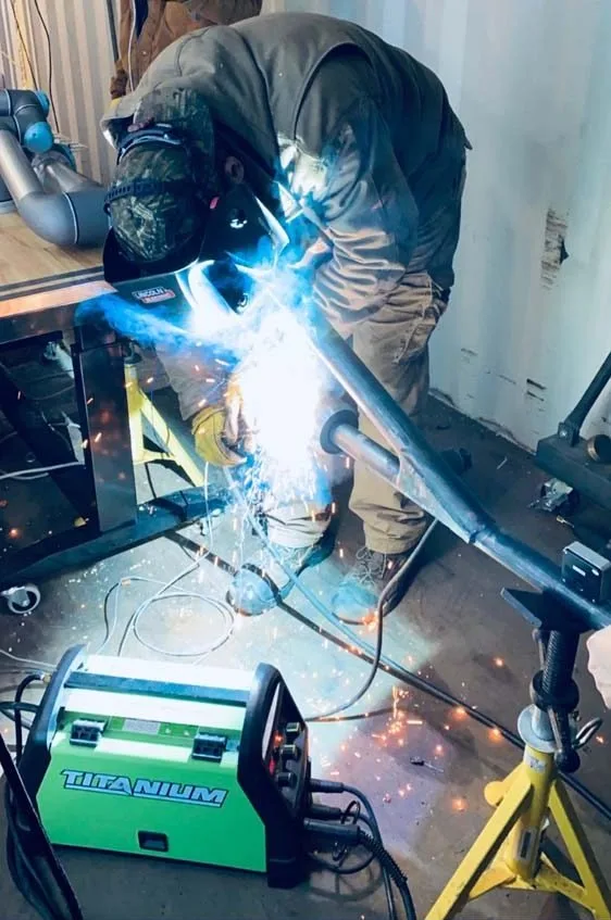 Welding a barrel section in the shop
